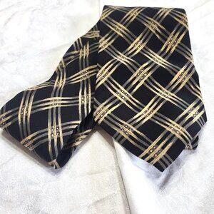 Geoffrey Beene Tie set in with a Black background and Gold Pattern.